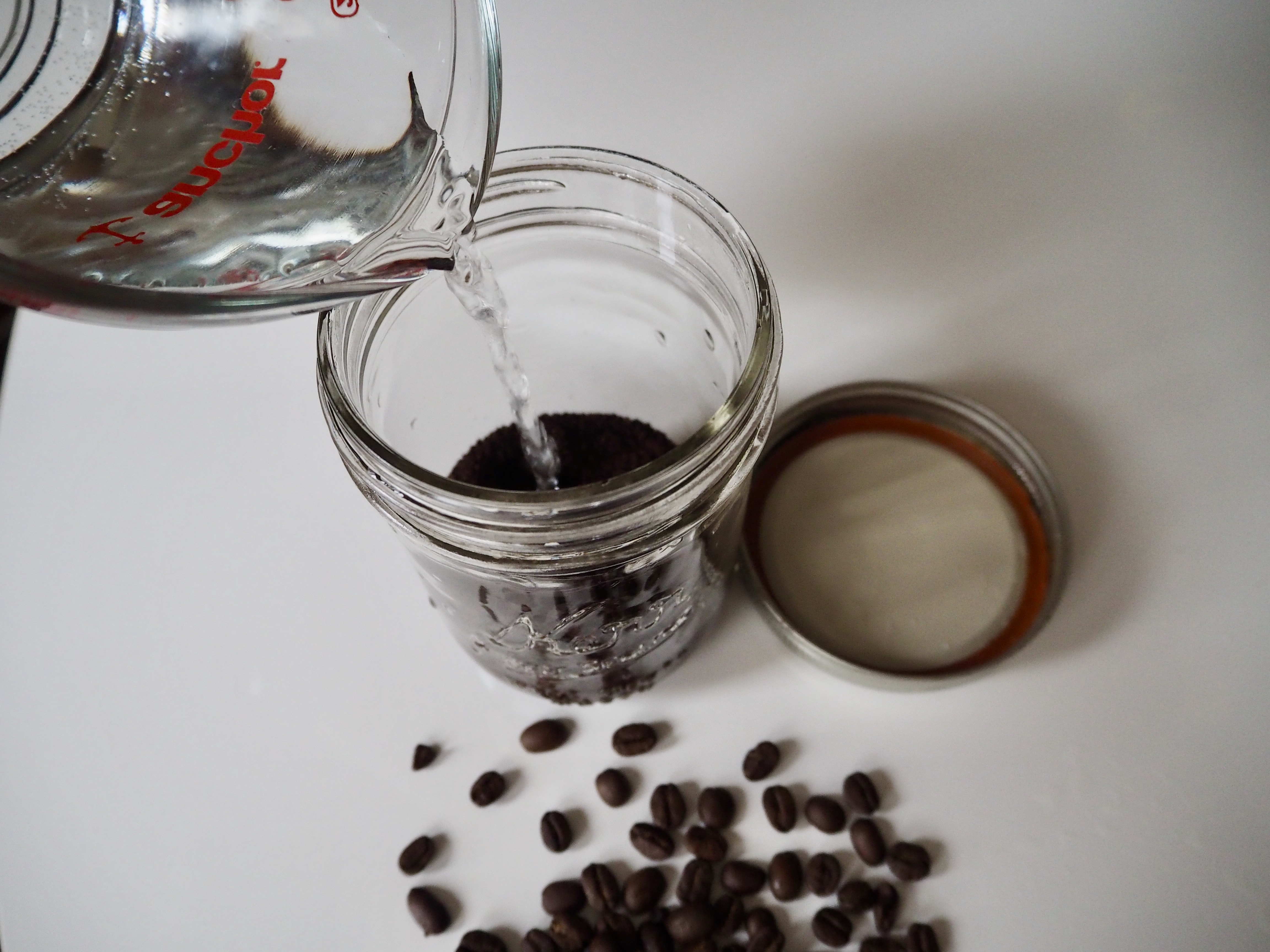 Add water to cold brew grounds