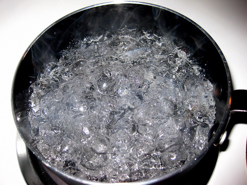 Boiling water for indirect solvent coffee decaf process