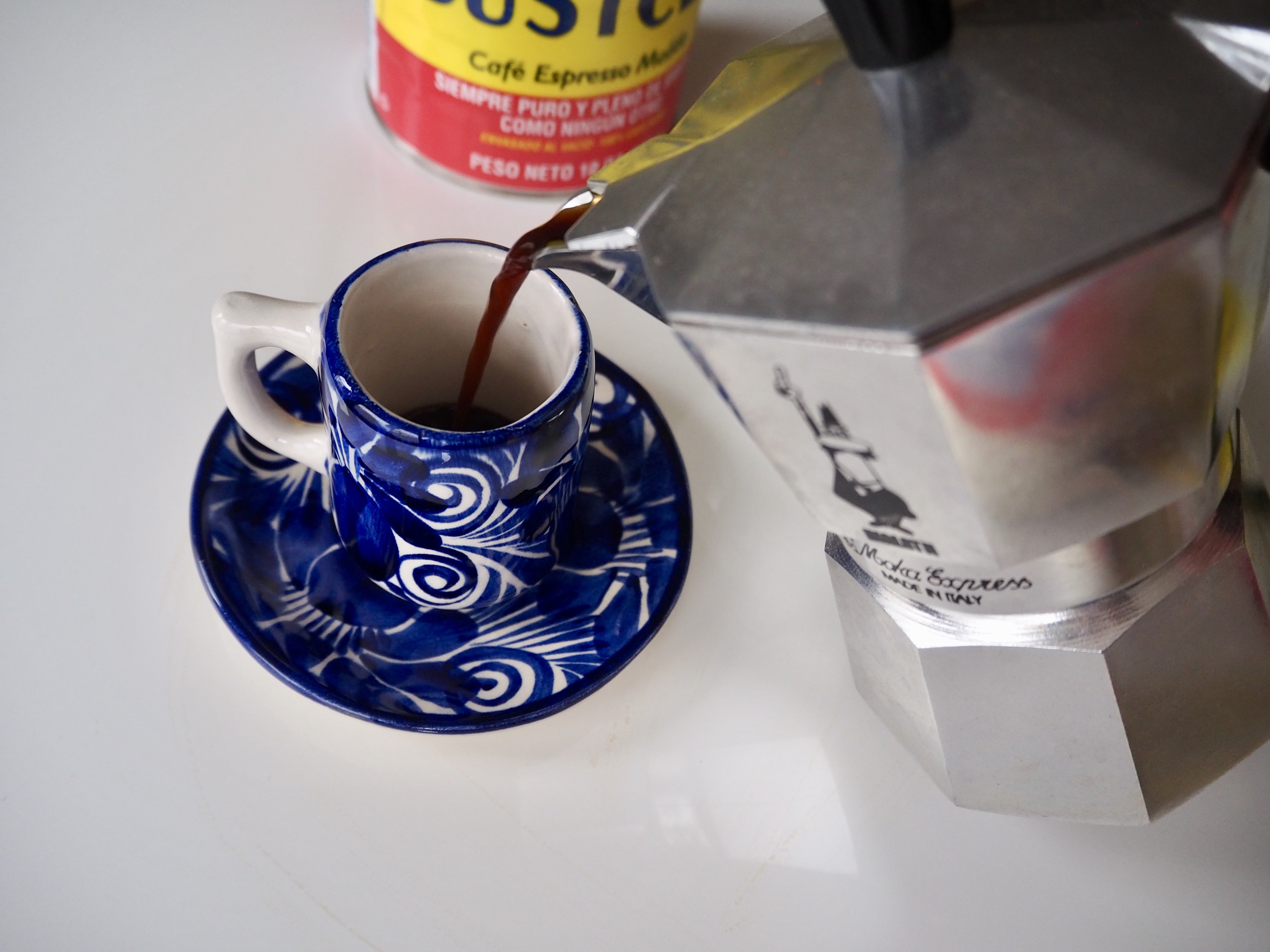 Pour espresso into cup