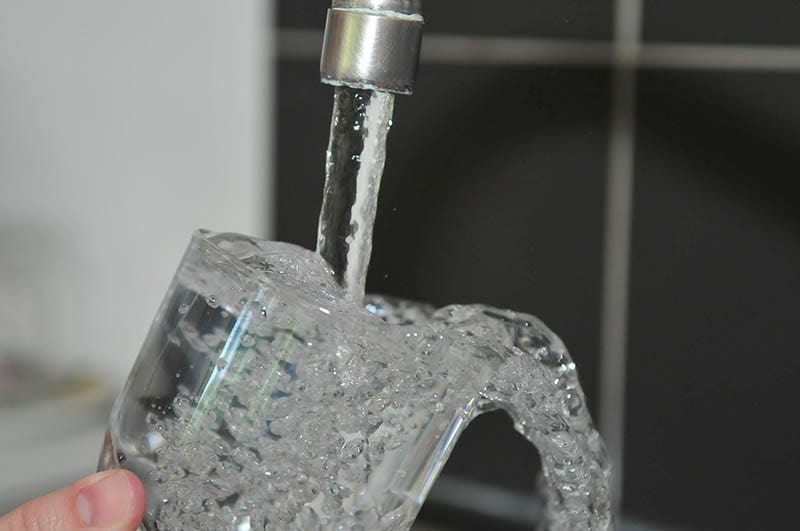 filling glass with tap water
