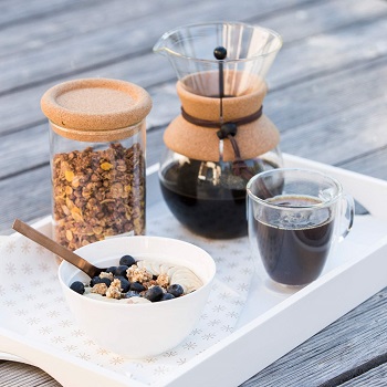 A Bodum Pour Over Coffee Maker next to a breakfast meal