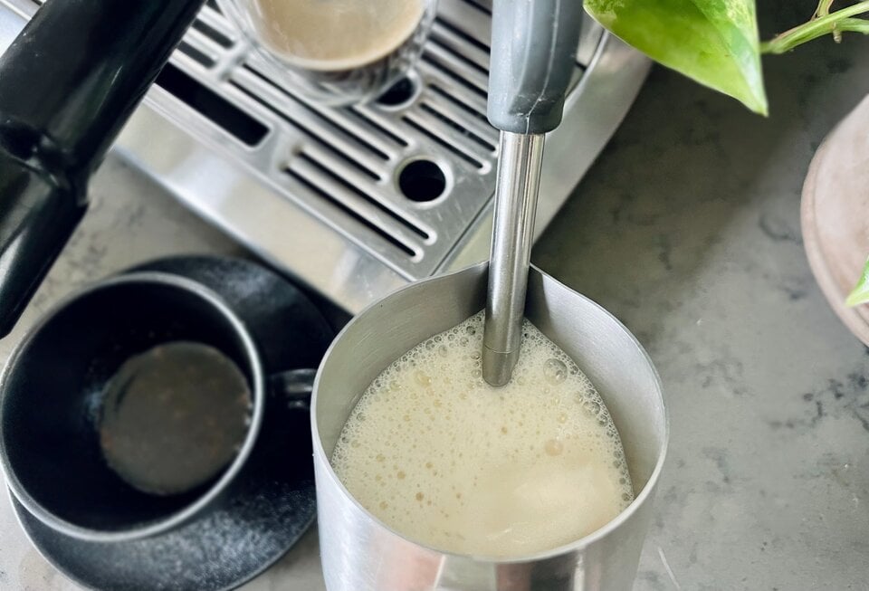 steaming and frothing the milk for maple latte