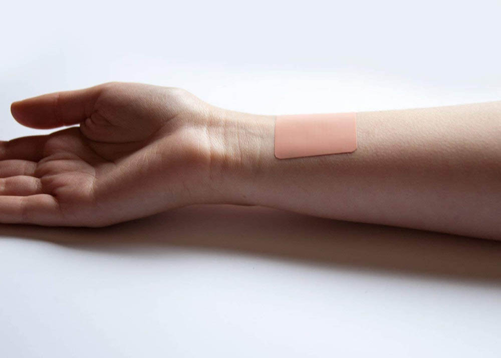 Vie Caffeine Patch on a person's arm