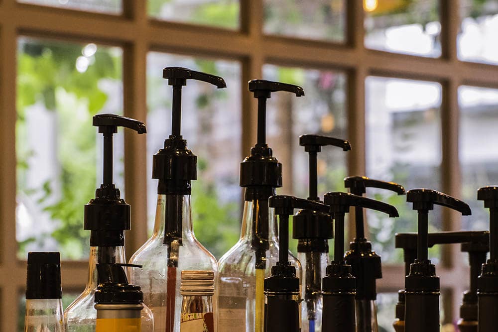syrup bottles in coffee shop