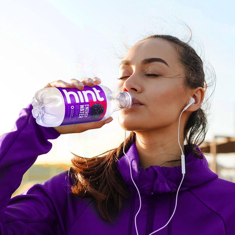 woman drinking Hint Energy Water Black Raspberry
