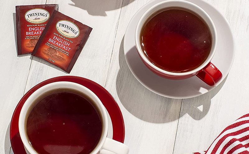 two cups of twinings english breakfast black and tea bags