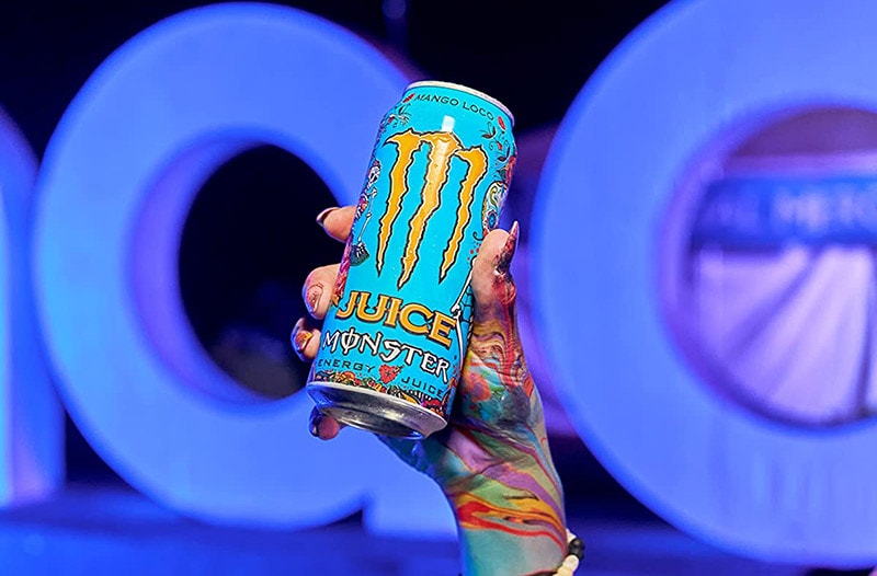 female hand holding monster mango loco