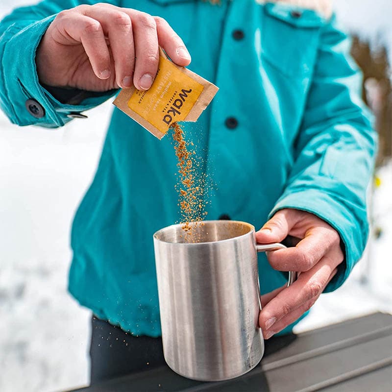 person preparing Waka Quality Instant Coffee